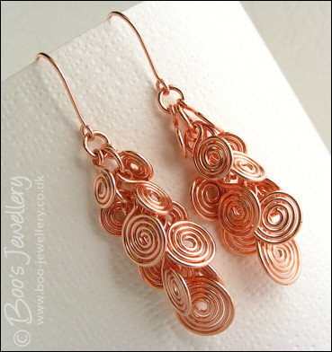 Fluid copper spirals earrings