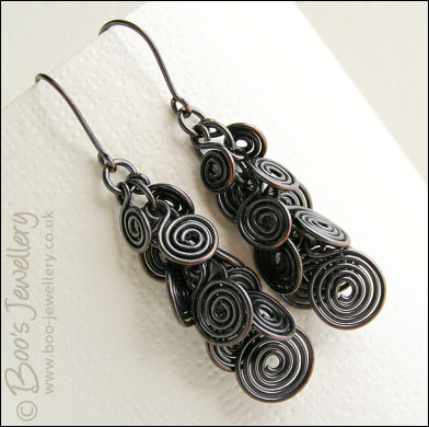 Fluid copper spirals earrings