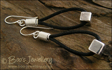Greek silver cubes on cotton