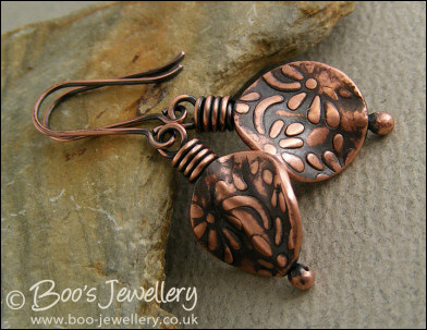 Flower embossed button bead earrings in antiqued copper