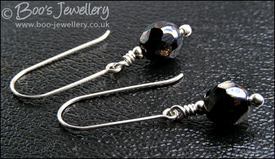 Gunmetal faceted crystal earrings on long silver drops