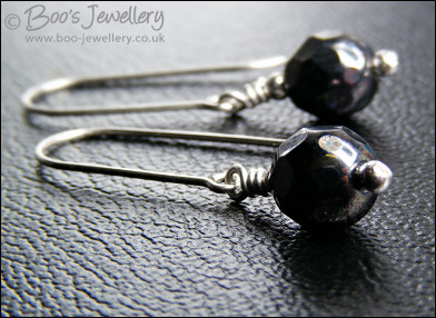 Gunmetal faceted crystal earrings on long silver drops