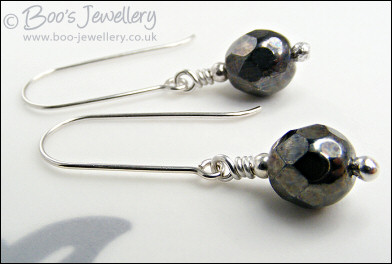 Gunmetal faceted crystal earrings on long silver drops