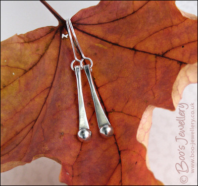 Sterling silver drop earrings with pebbles of solid silver