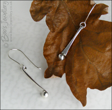 Sterling silver drop earrings with pebbles of solid silver