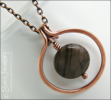 Copper circle pendant with integral chocolate jasper dangle