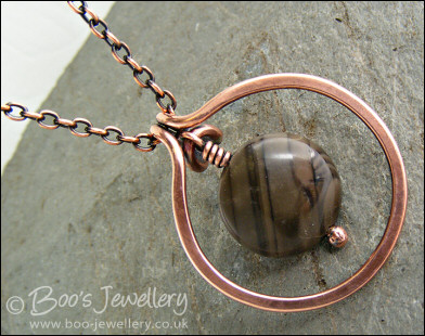 Copper circle pendant with integral chocolate jasper dangle