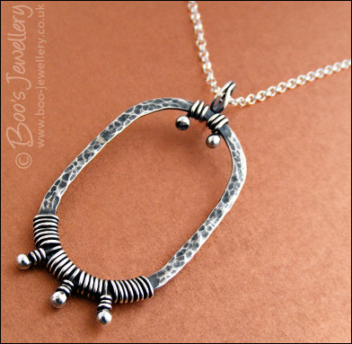 Hammered Sterling silver necklace wrapped with silver buds