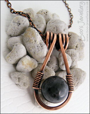 Antiqued copper necklace featuring a teardrop shaped pendant