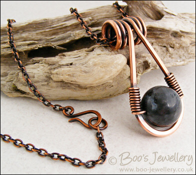 Antiqued copper necklace featuring a teardrop shaped pendant
