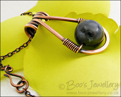 Antiqued copper necklace featuring a teardrop shaped pendant