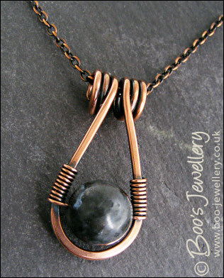 Antiqued copper necklace featuring a teardrop shaped pendant