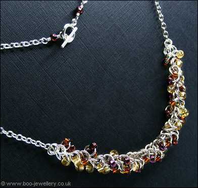 Shaggy Loops beaded necklace and earrings in amber tones