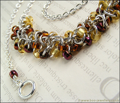 Shaggy Loops beaded necklace and earrings in amber tones