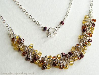 Shaggy Loops beaded necklace and earrings in amber tones