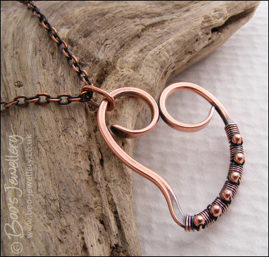 Curly antiqued copper heart wrapped with beads