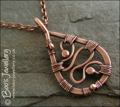 Squiggle filled antiqued copper teardrop pendant