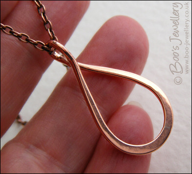 Polished copper teardrop loop pendant