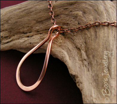 Polished copper teardrop loop pendant