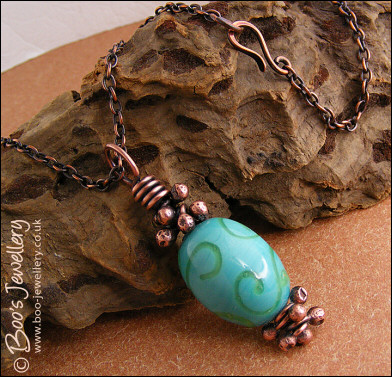 Turquoise and green glass and copper pendant