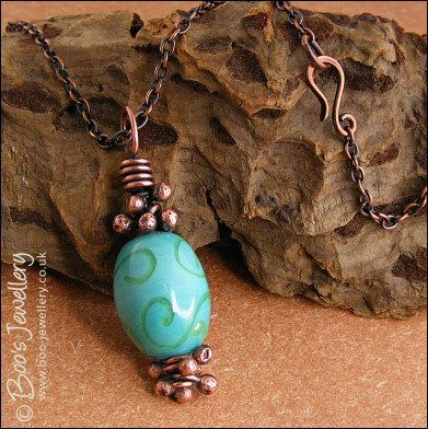 Turquoise and green glass and copper pendant