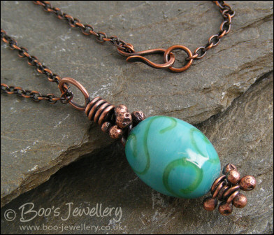 Turquoise and green glass and copper pendant