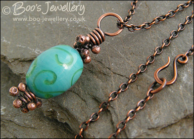 Turquoise and green glass and copper pendant