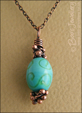 Turquoise and green glass and copper pendant