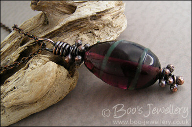 Aubergine and green glass pendant with molten buds