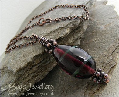 Aubergine and green glass pendant with molten buds