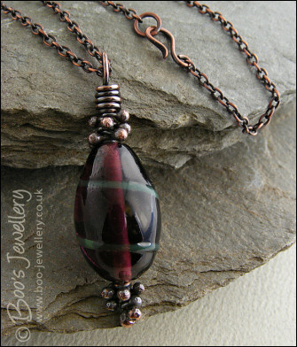 Aubergine and green glass pendant with molten buds
