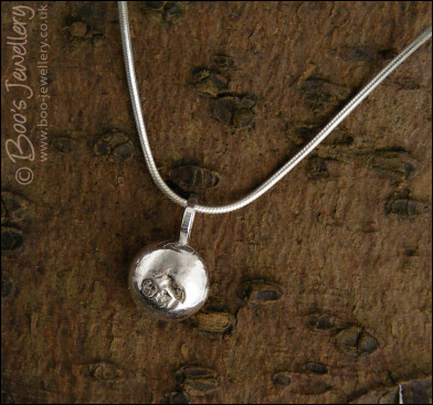 Silver molten pebble pendant