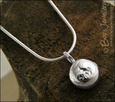 Silver molten pebble pendant