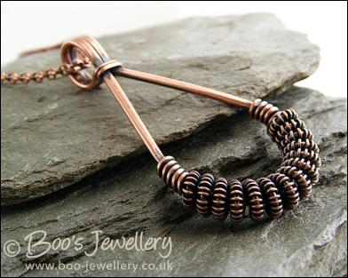Antiqued copper teardrop pendant with spiralled coils
