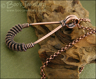 Antiqued copper teardrop pendant with spiralled coils