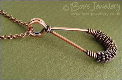 Antiqued copper teardrop pendant with spiralled coils