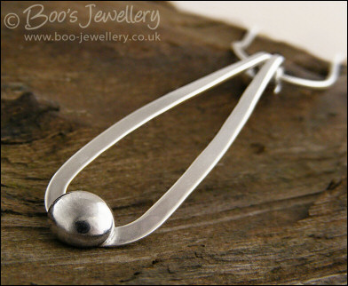 Sterling silver teardrop pendant with pebble of silver