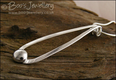Sterling silver teardrop pendant with pebble of silver