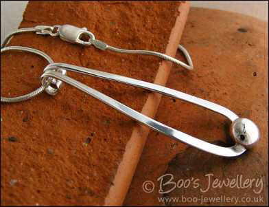 Sterling silver teardrop pendant with pebble of silver