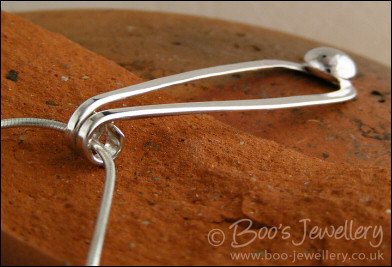 Sterling silver teardrop pendant with pebble of silver