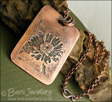 Antiqued copper etched daisy pendant
