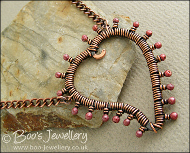 Antiqued copper heart necklace wire wrapped with rosy buds