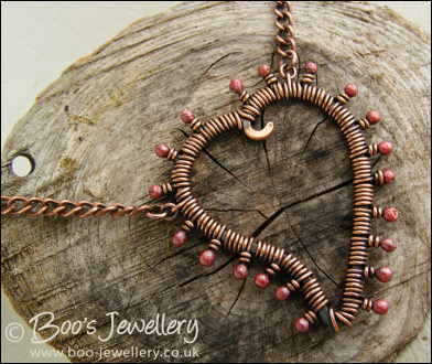 Antiqued copper heart necklace wire wrapped with rosy buds