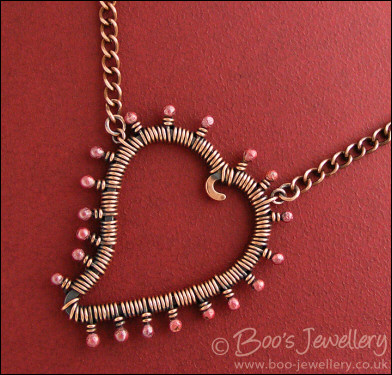 Antiqued copper heart necklace wire wrapped with rosy buds