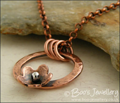 Hammered copper ring and flower necklace