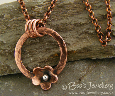 Hammered copper ring and flower necklace