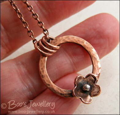 Hammered copper ring and flower necklace