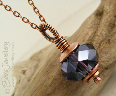 Faceted amethyst glass and copper pendant on chain