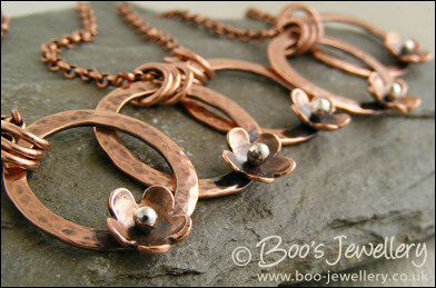 Hammered copper ring and flower necklace