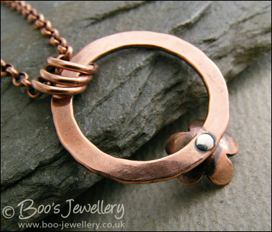 Hammered copper ring and flower necklace